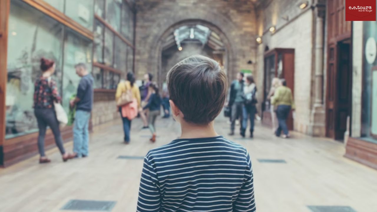 Boy standing in a museum