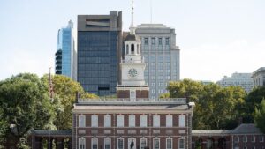 Wikipedia  Alt text - Independence Hall with clock tower and red-brick Georgian facade.