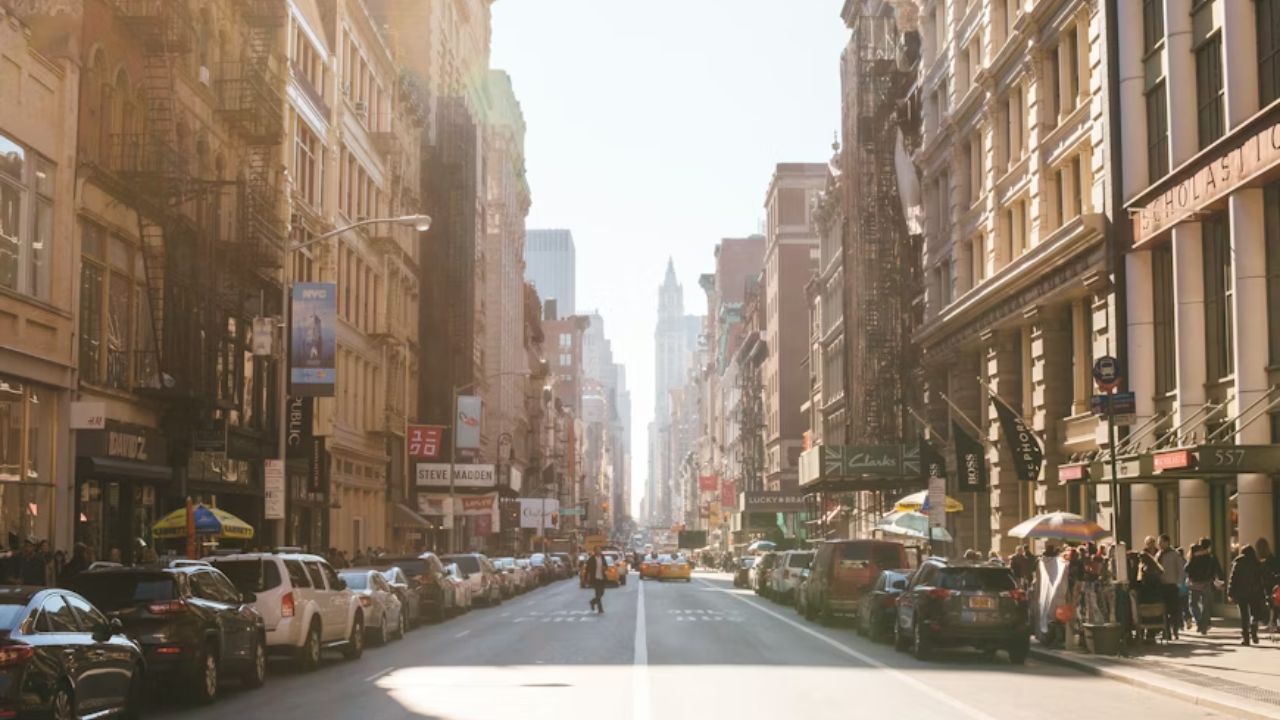 SoHo NYC street view with Scholastic building and taxis.