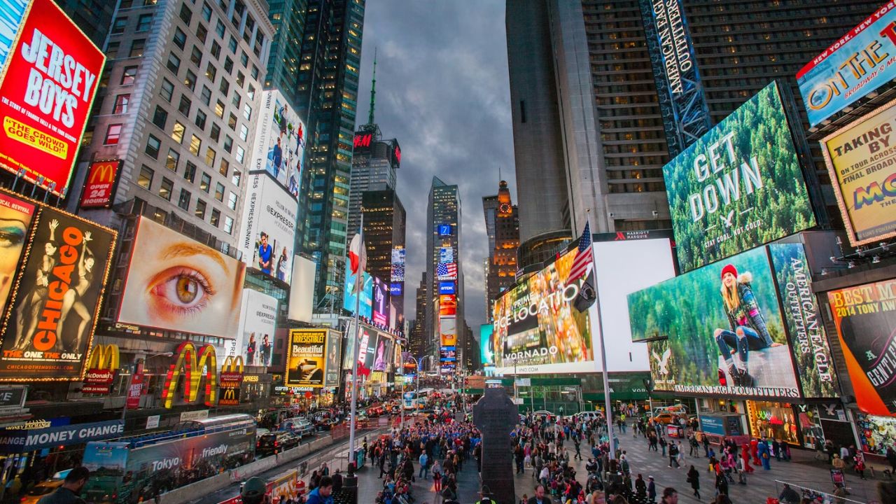 Crowds and illuminated billboards in Times Square, New York City.