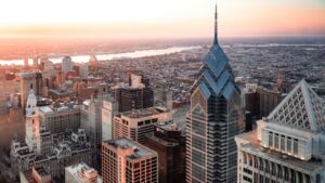 Philadelphia skyline at sunset with Liberty Place and City Hall.