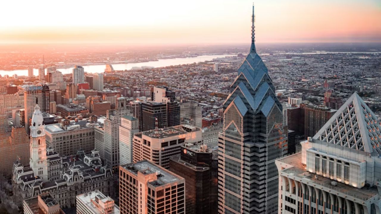 Philadelphia skyline at sunset with Liberty Place and City Hall. 