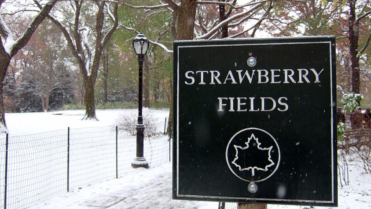 Snow-covered Strawberry Fields memorial sign in Central Park.
