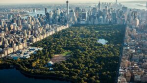 Aerial view of Central Park surrounded by Manhattan skyscrapers.