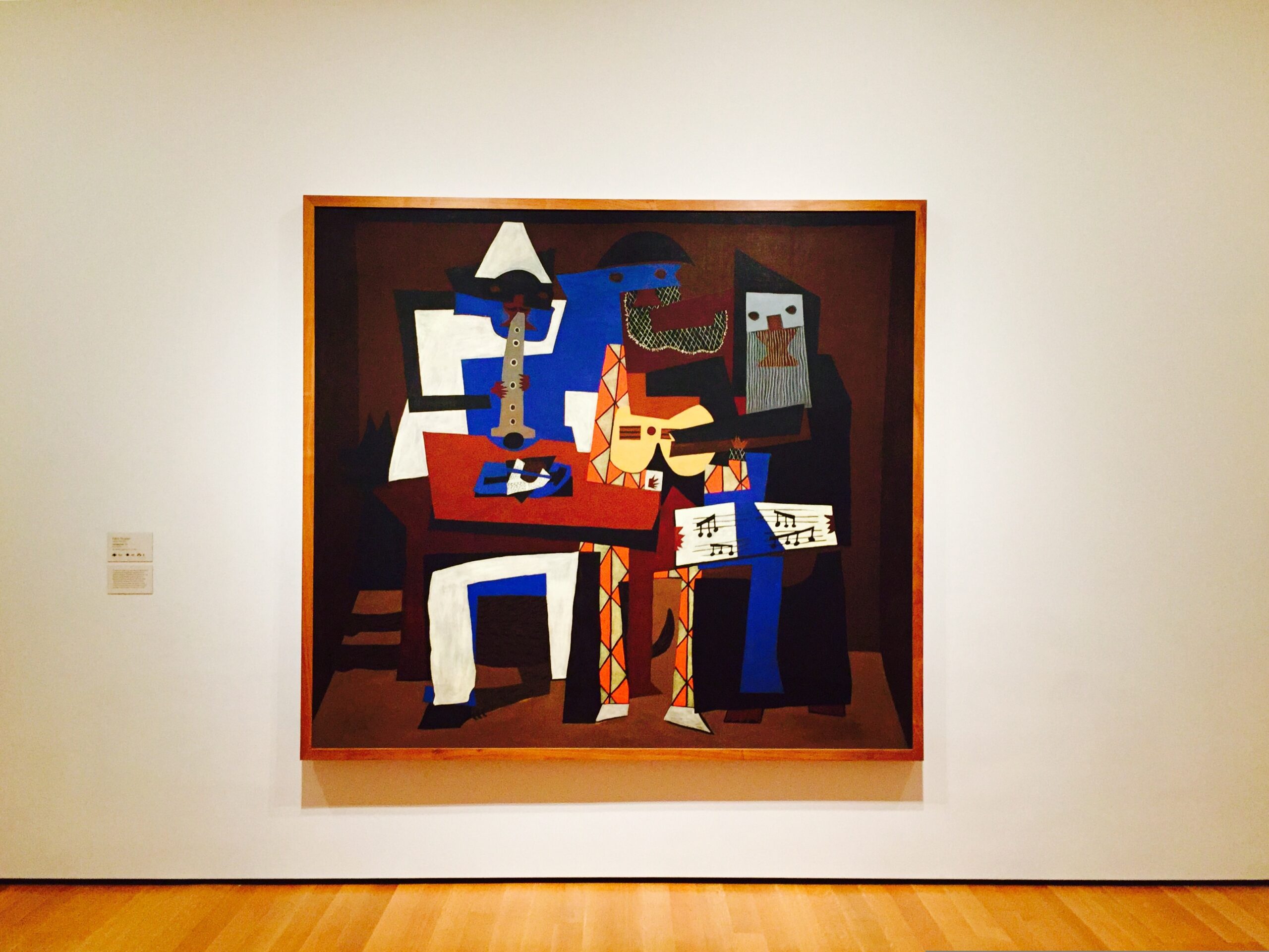 An abstract contemporary art piece displayed at The Museum of Modern Art (MoMA), featuring modern design elements, bold shapes, and expressive use of color in a gallery setting.