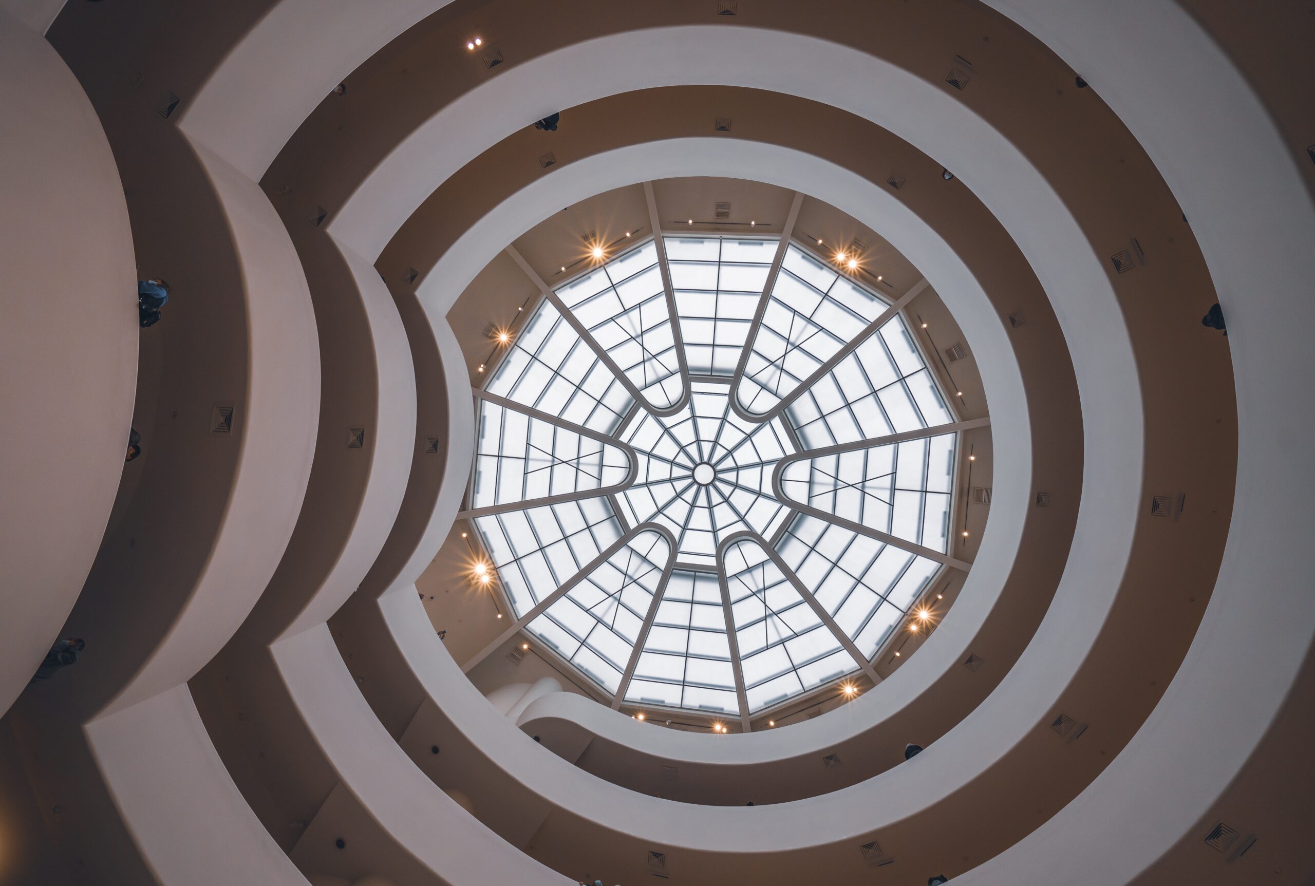 Looking up at the iconic spiral rotunda and glass skylight dome of the Solomon R. Guggenheim Museum in New York City