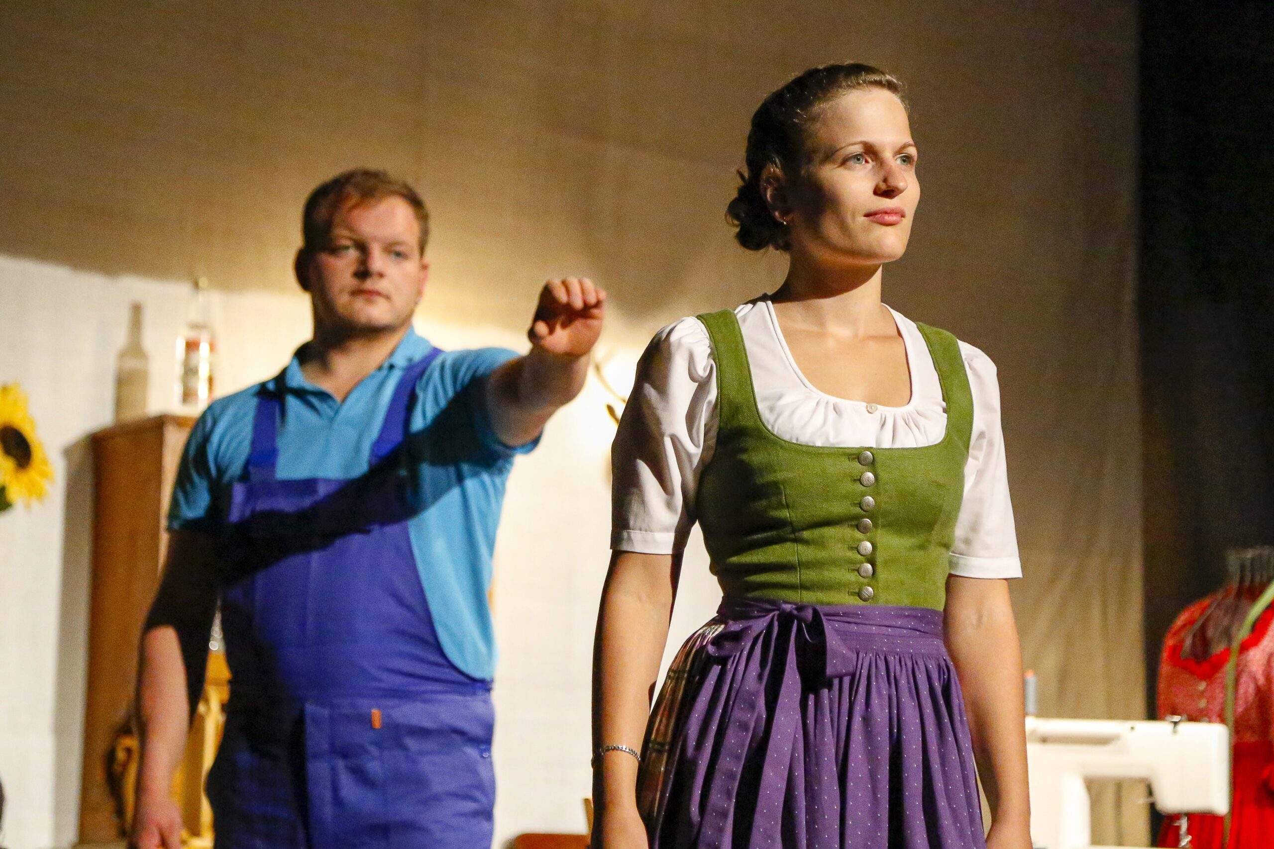 Actors in costume performing on a stage