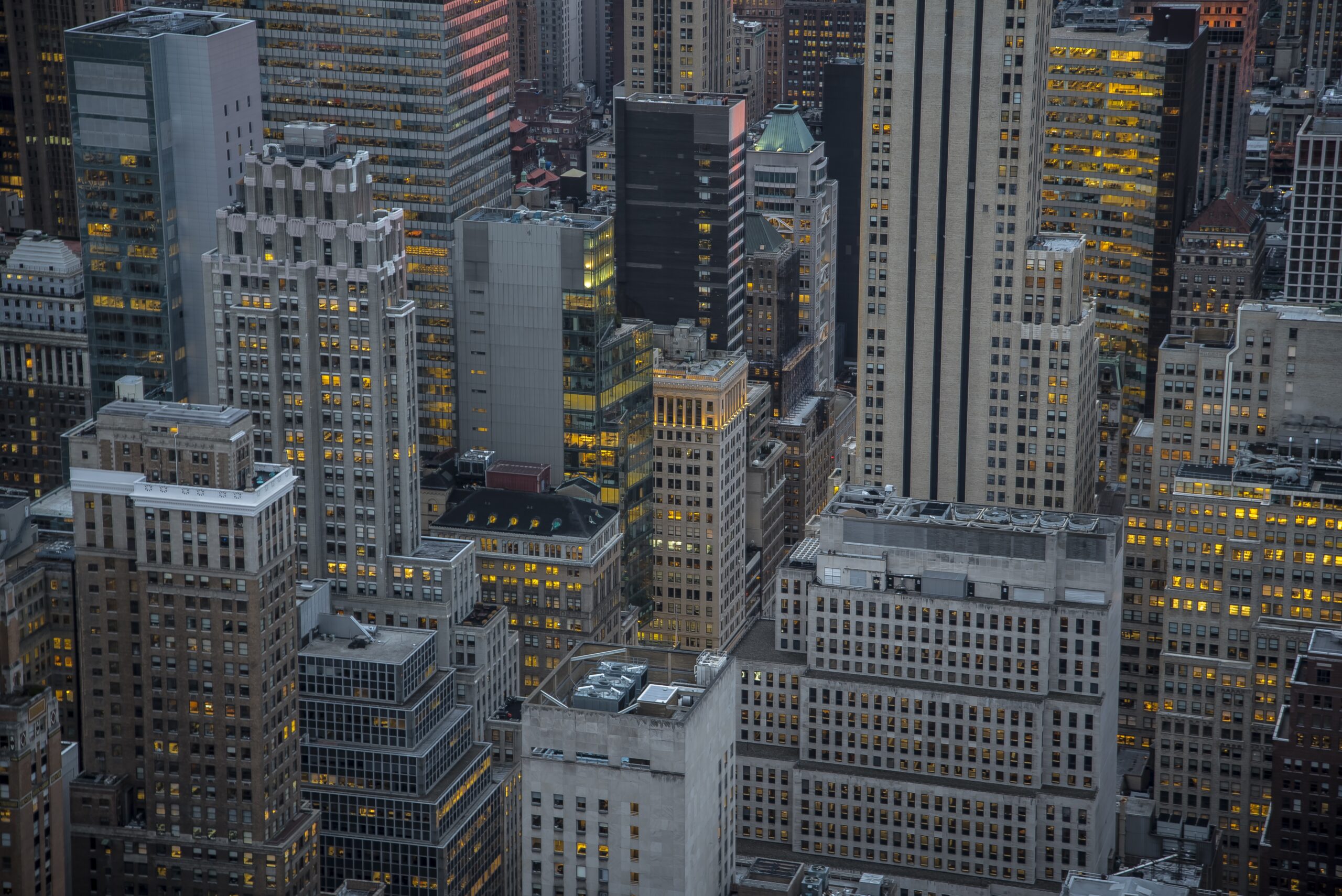 Aerial view of dense Manhattan skyscrapers at dusk