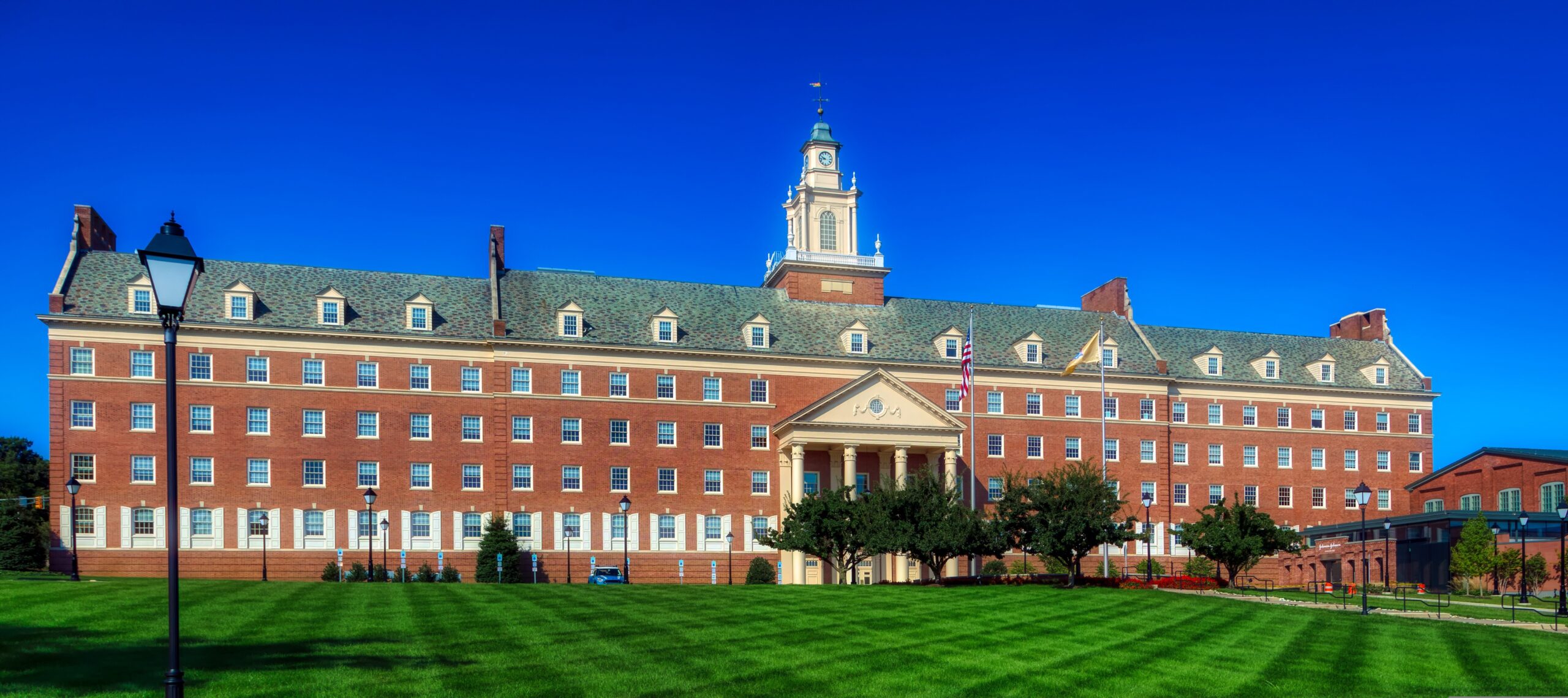 Brick colonial-style building with central clock tower