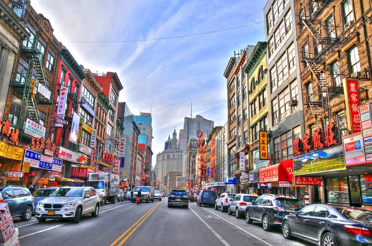 Busy Chinatown street with colorful storefront signage