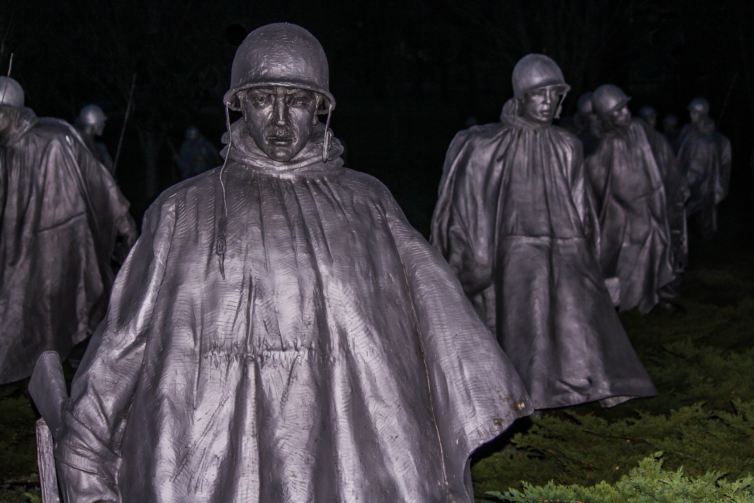Korean War Veterans Memorial soldiers in ponchos, night view
