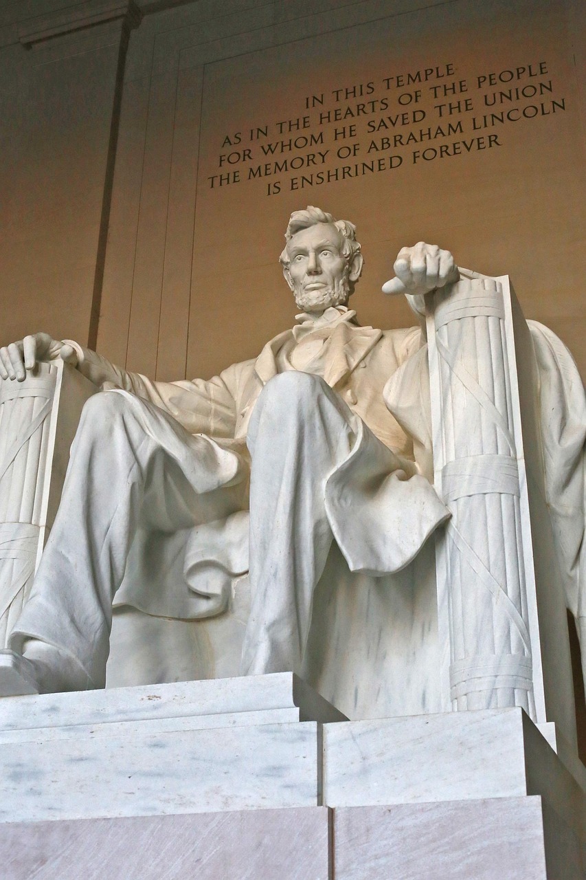 Lincoln Memorial statue beneath engraved dedication inscription