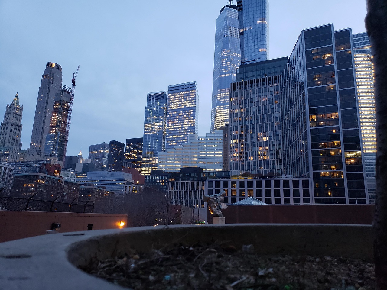 New York City skyline lit up at dusk