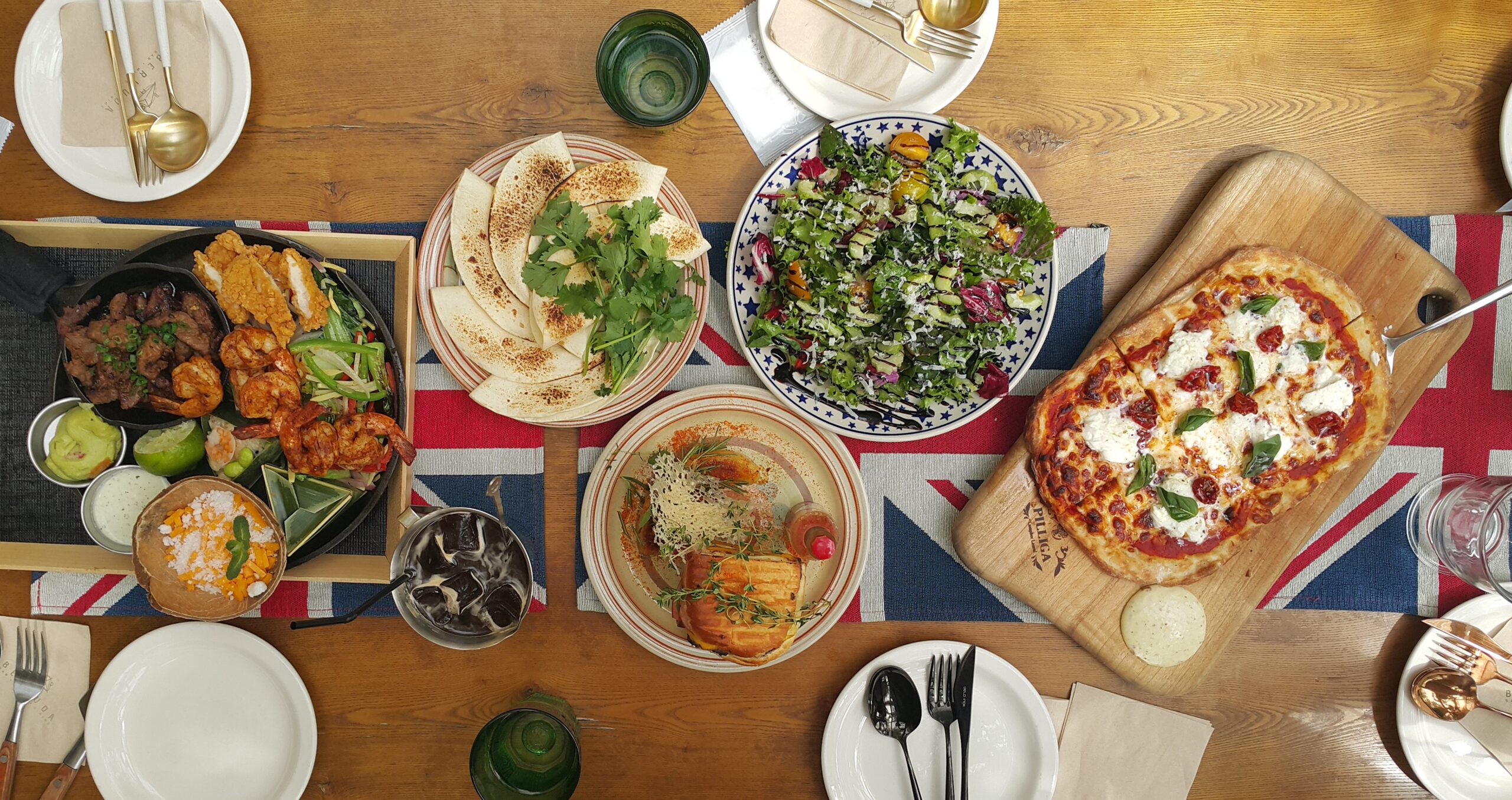 Overhead view of multiple dishes on a dining table