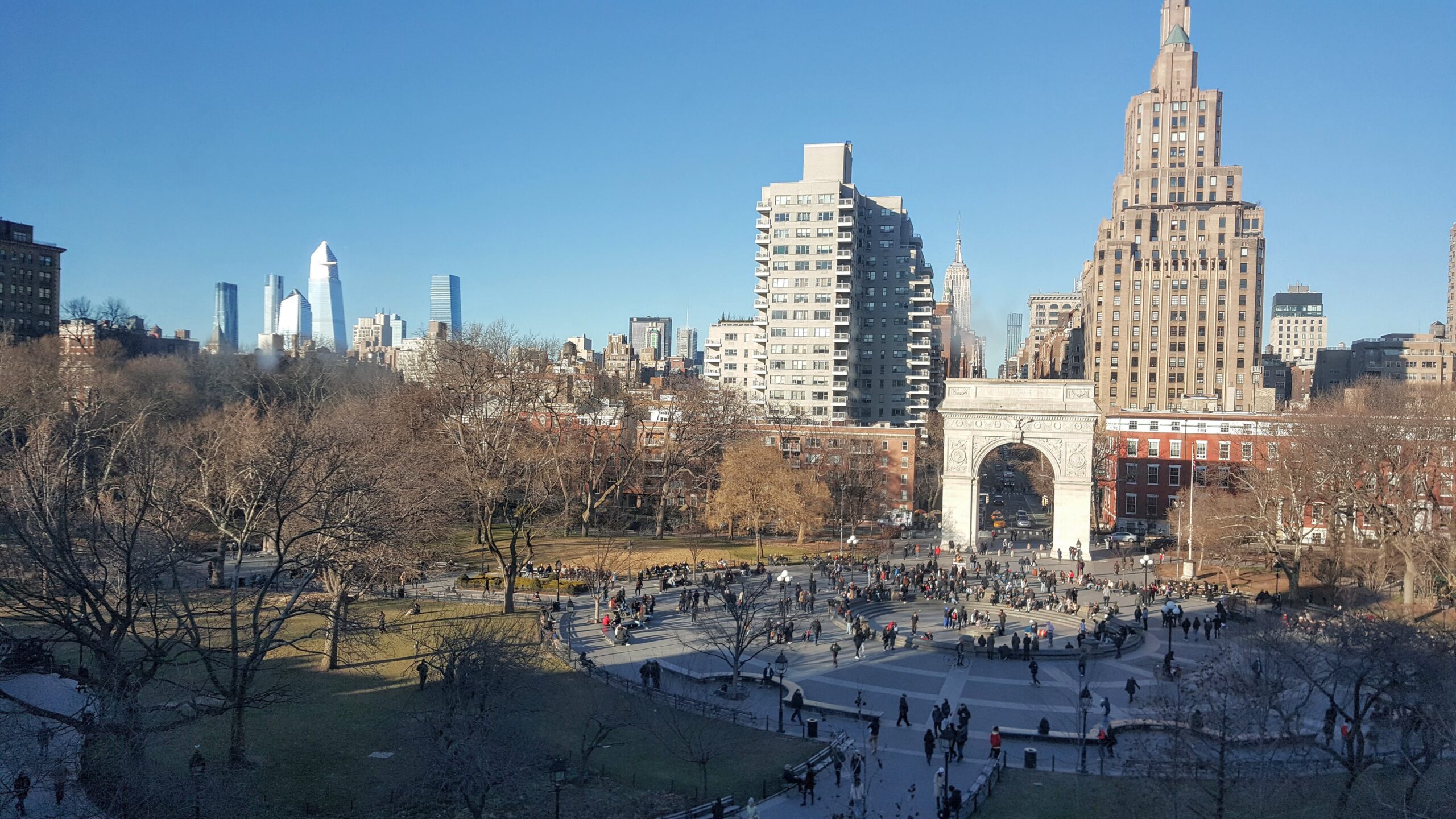 Washington Square Park arch with city skyline backdrop