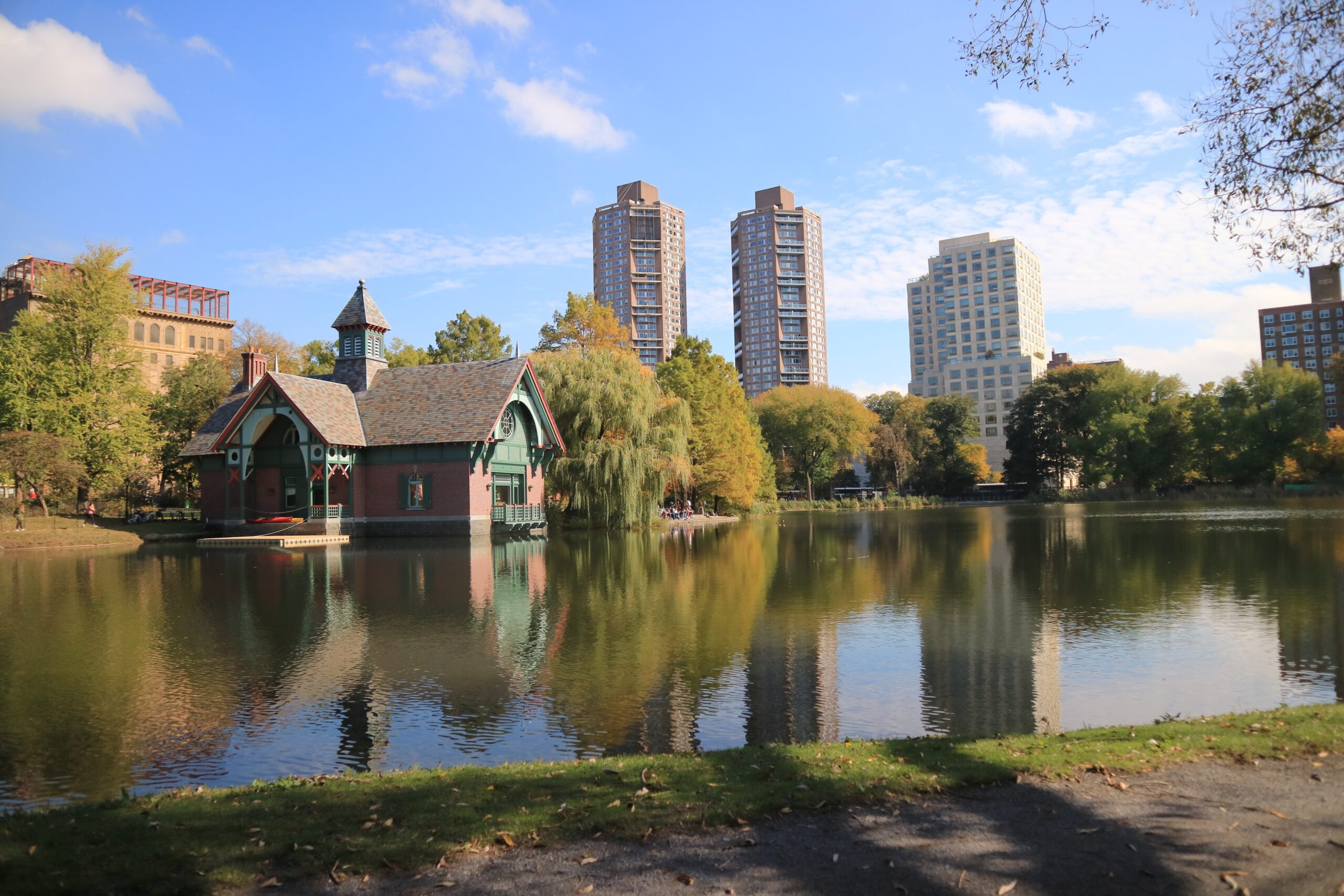 Central Park boathouse reflected in calm autumn lake