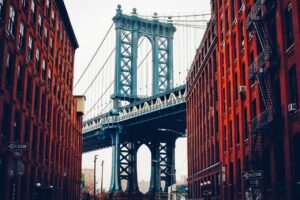 Manhattan Bridge framed by DUMBO's red brick buildings