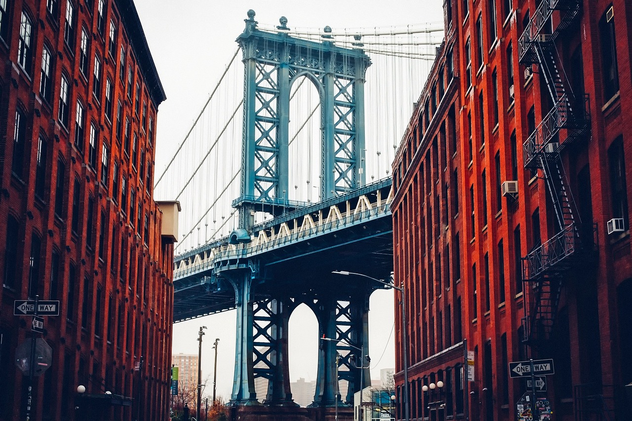 Manhattan Bridge framed by DUMBO's red brick buildings